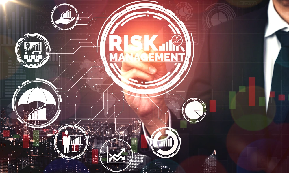 Paradigm Shift Consulting - Quality Risk Management (QRM) - Blog - businessman-with-quality-risk-management-symbols-and-city-by-night-backdrop